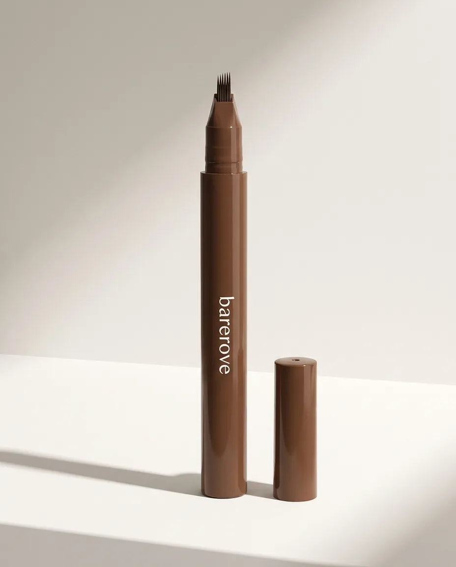 The pen on white, cap off, 4-tine tip visible